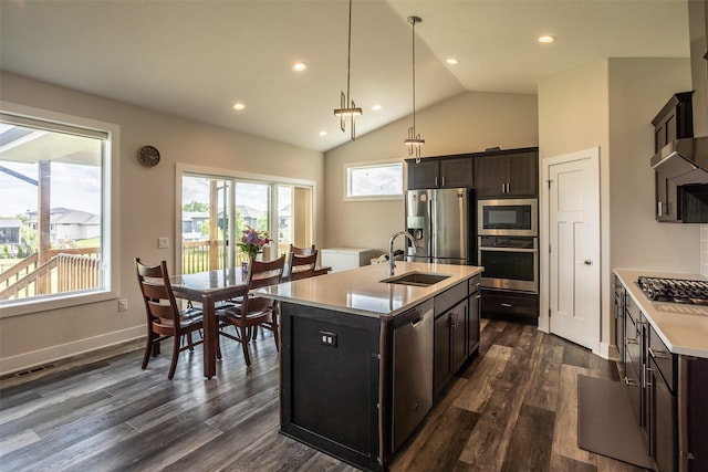 3021 NE 17th St, Ankeny, IA 50021 - kitchen with appliances with stainless steel finishes, a sink, light countertops, vaulted ceiling, and an island with sink