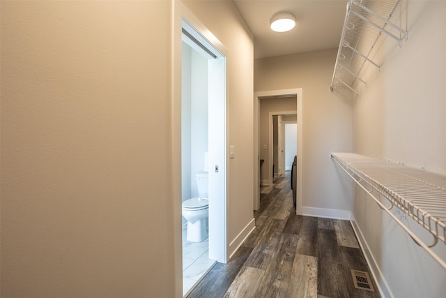 3021 NE 17th St, Ankeny, IA 50021 - walk in closet featuring dark wood finished floors