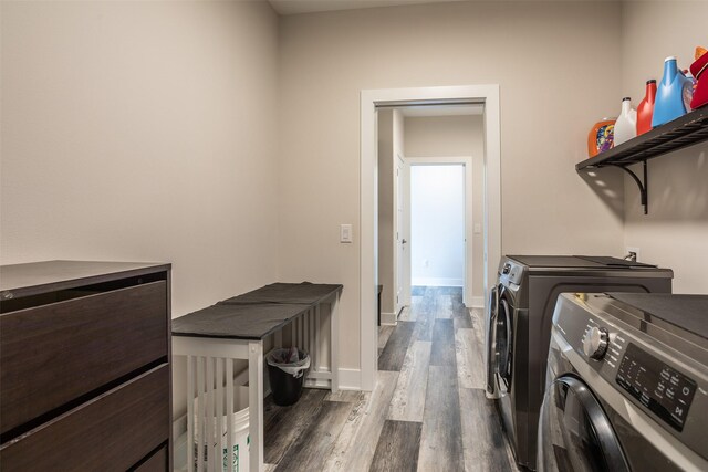 3021 NE 17th St, Ankeny, IA 50021 - laundry area featuring washer and clothes dryer, dark wood-type flooring, and baseboards