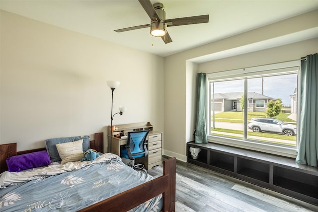 3021 NE 17th St, Ankeny, IA 50021 - bedroom featuring wood finished floors, baseboards, and ceiling fan