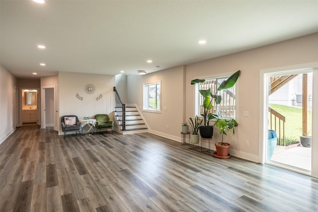 3021 NE 17th St, Ankeny, IA 50021 - living area featuring stairs, wood finished floors, recessed lighting, and baseboards