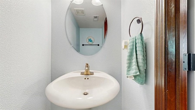 1401 N 6th St Unit 7, Indianola, IA 50125 - bathroom with a sink and a textured wall