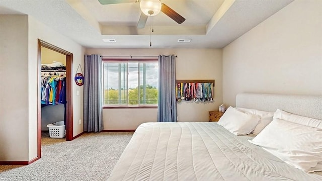 1401 N 6th St Unit 7, Indianola, IA 50125 - bedroom with a raised ceiling, carpet floors, a spacious closet, baseboards, and a closet