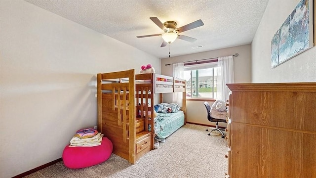 1401 N 6th St Unit 7, Indianola, IA 50125 - carpeted bedroom featuring a textured ceiling, baseboards, and ceiling fan