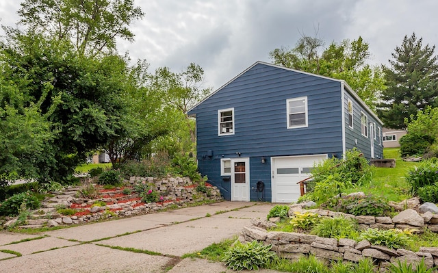 3020 62nd St, Des Moines, IA 50322 - view of property exterior with concrete driveway and a garage