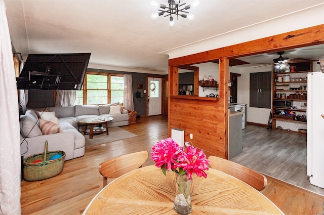 3020 62nd St, Des Moines, IA 50322 - living area with wood finished floors and a chandelier