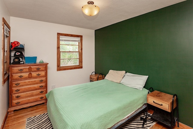 3020 62nd St, Des Moines, IA 50322 - bedroom featuring wood finished floors and baseboards