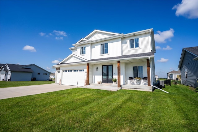 3338 9th Ave SW, Altoona, IA 50009 - view of front of house with driveway, a front lawn, french doors, and covered porch