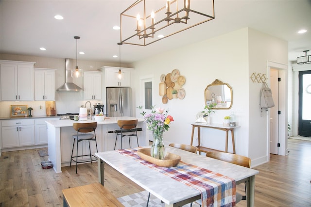3338 9th Ave SW, Altoona, IA 50009 - dining area featuring light wood-style floors, recessed lighting, and a chandelier