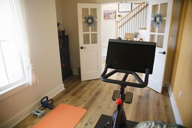 3338 9th Ave SW, Altoona, IA 50009 - exercise room featuring wood finished floors and baseboards