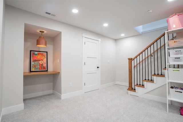 3338 9th Ave SW, Altoona, IA 50009 - carpeted foyer entrance featuring built in study area, stairs, baseboards, and recessed lighting