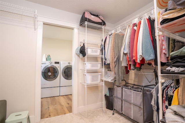 3338 9th Ave SW, Altoona, IA 50009 - laundry room with washing machine and clothes dryer and wood finished floors