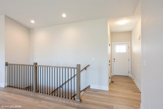 3412 5th Ave SE, Altoona, IA 50009 - corridor with wood finished floors, an upstairs landing, baseboards, and recessed lighting