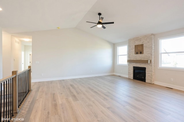 3412 5th Ave SE, Altoona, IA 50009 - unfurnished living room with a ceiling fan, light wood finished floors, vaulted ceiling, a fireplace, and baseboards