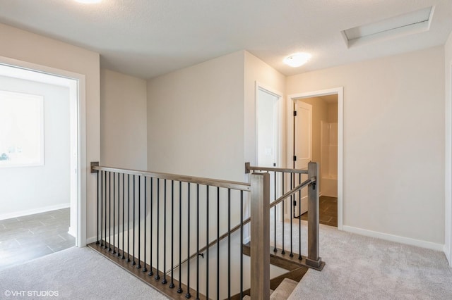3418 5th Ave SE, Altoona, IA 50009 - corridor with an upstairs landing, attic access, baseboards, and carpet floors