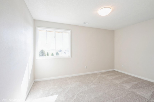 3418 5th Ave SE, Altoona, IA 50009 - unfurnished room featuring light carpet and baseboards