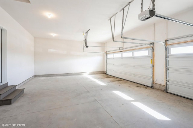 3418 5th Ave SE, Altoona, IA 50009 - garage featuring a garage door opener