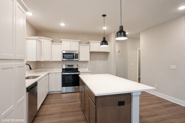 3424 5th Ave SE, Altoona, IA 50009 - kitchen featuring stainless steel appliances, a sink, dark wood finished floors, white cabinets, and recessed lighting
