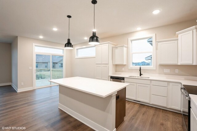 3424 5th Ave SE, Altoona, IA 50009 - kitchen with a sink, stainless steel appliances, a center island, white cabinetry, and dark wood finished floors