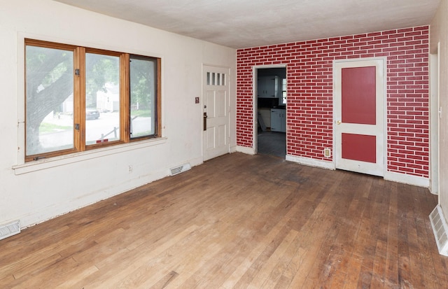 2721 Cornell St, Des Moines, IA 50313 - spare room featuring hardwood / wood-style flooring and baseboards