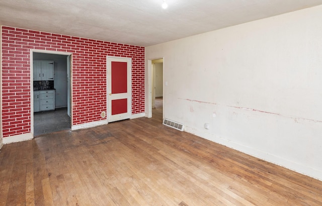 2721 Cornell St, Des Moines, IA 50313 - unfurnished room with hardwood / wood-style floors and baseboards