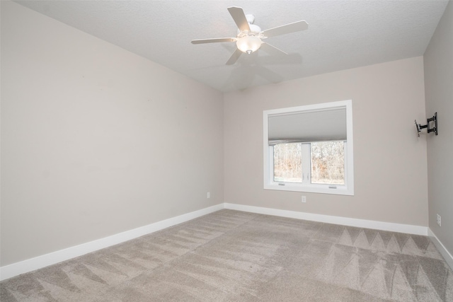 2011 Ammann Dr, Adel, IA 50003 - empty room featuring carpet flooring, baseboards, a ceiling fan, and a textured ceiling