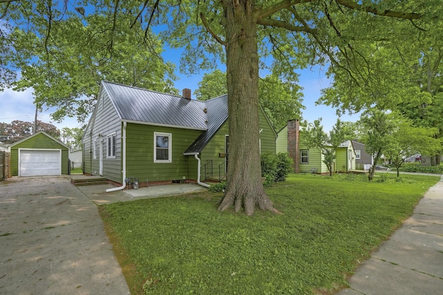 105 N Park Lane Dr, Knoxville, IA 50138 - view of front facade with concrete driveway, a garage, an outdoor structure, a chimney, and a front yard