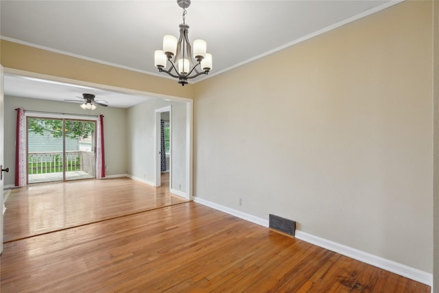 105 N Park Lane Dr, Knoxville, IA 50138 - empty room with a chandelier, light wood finished floors, baseboards, a ceiling fan, and crown molding