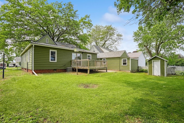 105 N Park Lane Dr, Knoxville, IA 50138 - back of house with a wooden deck, a lawn, central air condition unit, and crawl space