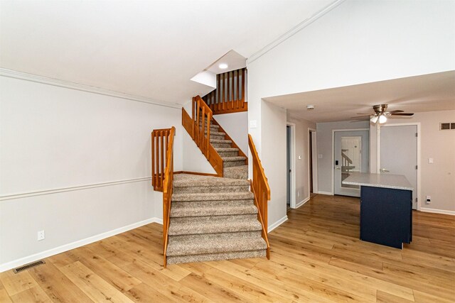1717 Linn St, Boone, IA 50036 - stairs with wood finished floors, baseboards, and a ceiling fan