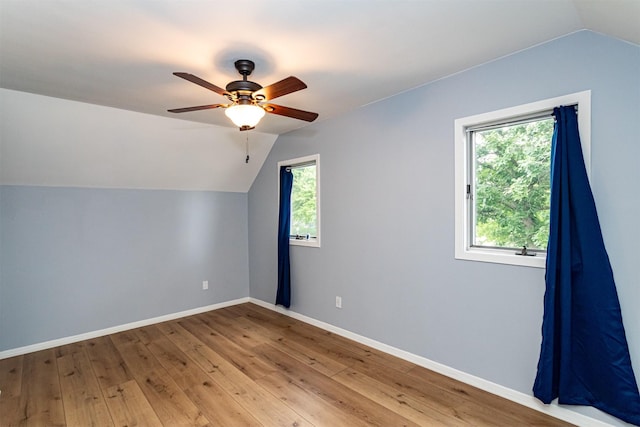 1717 Linn St, Boone, IA 50036 - bonus room featuring lofted ceiling, baseboards, ceiling fan, and hardwood / wood-style flooring