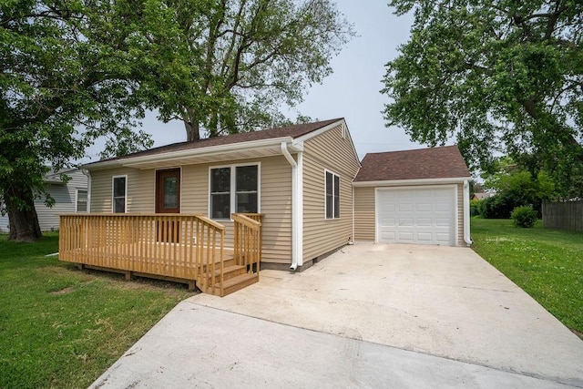 400 E 22nd St S, Newton, IA 50208 - view of front facade featuring a front yard, concrete driveway, a deck, and a garage