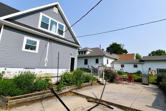 231 S 1st St, Ogden, IA 50212 - back of house with a patio