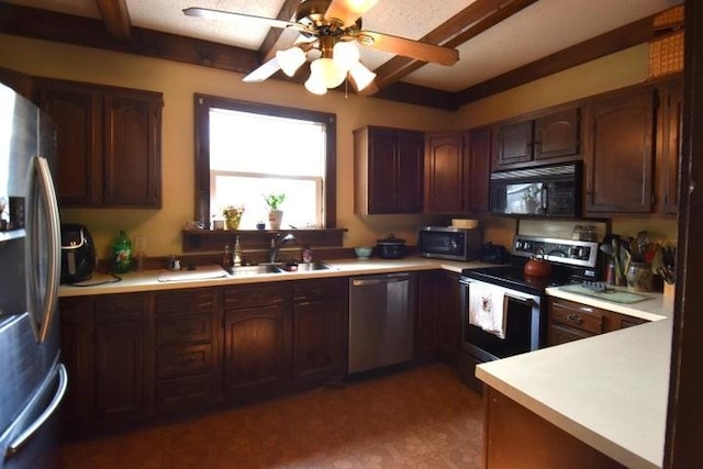 231 S 1st St, Ogden, IA 50212 - kitchen featuring stainless steel appliances, light countertops, a sink, and ceiling fan