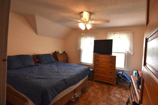 231 S 1st St, Ogden, IA 50212 - bedroom featuring a textured ceiling, carpet floors, a ceiling fan, and vaulted ceiling