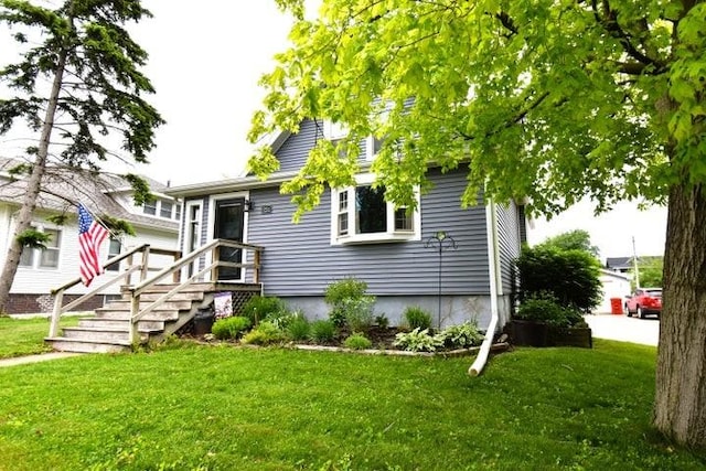 231 S 1st St, Ogden, IA 50212 - view of front of property with a front lawn