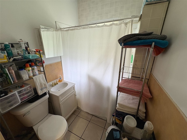 1555 16th St, Des Moines, IA 50314 - bathroom with toilet, a shower with curtain, tile patterned flooring, and vanity