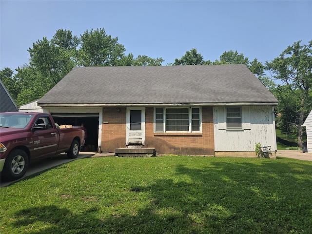 7306 SW 12th St, Des Moines, IA 50315 - view of front facade featuring an attached garage, brick siding, a front yard, and a shingled roof