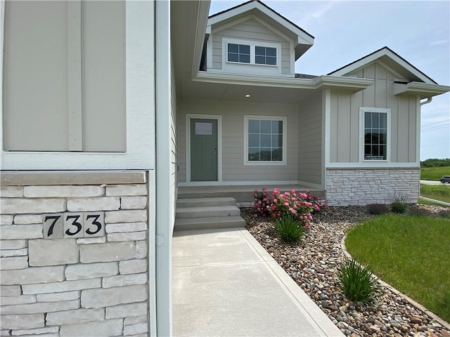 733 17th Ave SE, Altoona, IA 50009 - entrance to property with board and batten siding and stone siding
