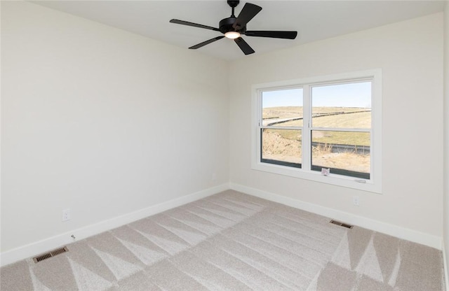 733 17th Ave SE, Altoona, IA 50009 - empty room with light colored carpet and ceiling fan
