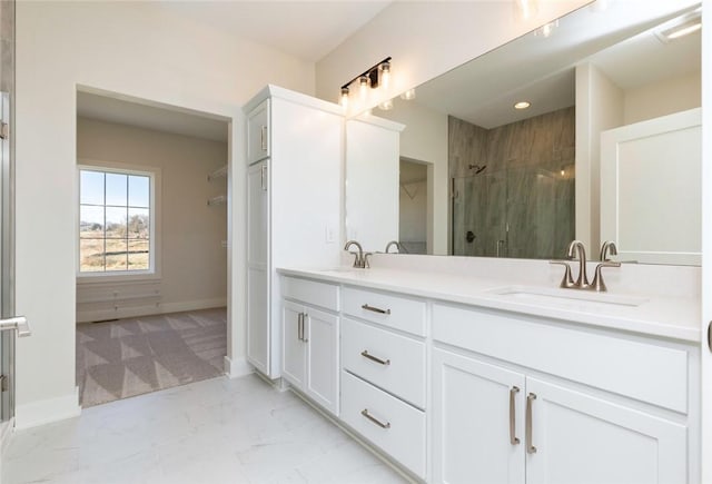 733 17th Ave SE, Altoona, IA 50009 - bathroom with double vanity, a stall shower, marble look tiles, a spacious closet, and recessed lighting