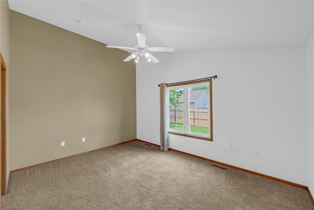 810 NE 5th St, Ankeny, IA 50021 - empty room with carpet floors, baseboards, ceiling fan, and lofted ceiling