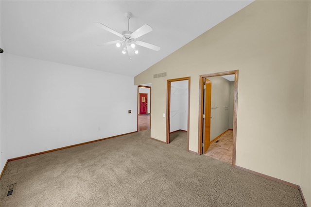 810 NE 5th St, Ankeny, IA 50021 - unfurnished bedroom featuring carpet, a walk in closet, baseboards, high vaulted ceiling, and a closet