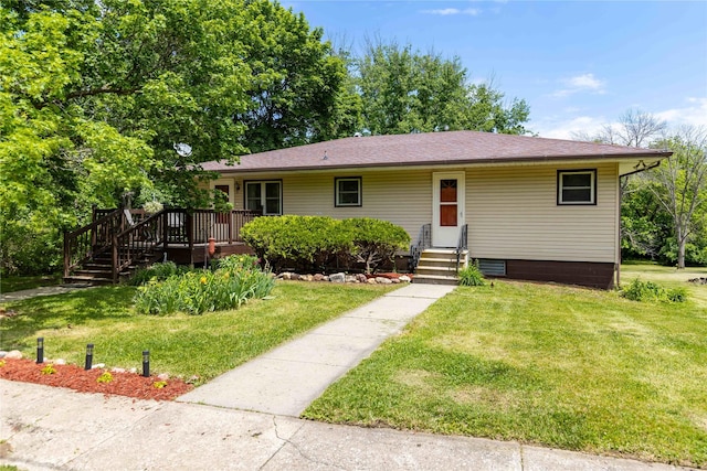 403 S Elm St, Lamoni, IA 50140 - single story home with a front lawn, a wooden deck, entry steps, and roof with shingles