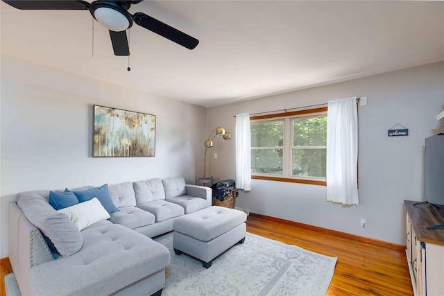 403 S Elm St, Lamoni, IA 50140 - living room with ceiling fan, light wood-type flooring, and baseboards