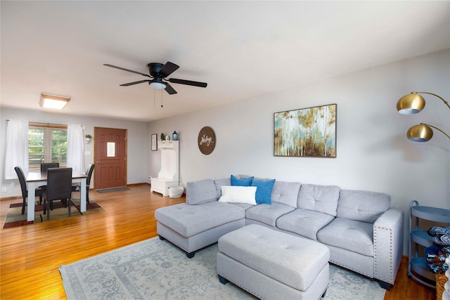 403 S Elm St, Lamoni, IA 50140 - living room featuring light wood-style flooring and a ceiling fan