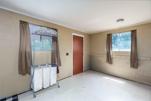 403 S Elm St, Lamoni, IA 50140 - unfurnished room with ornamental molding and concrete block wall
