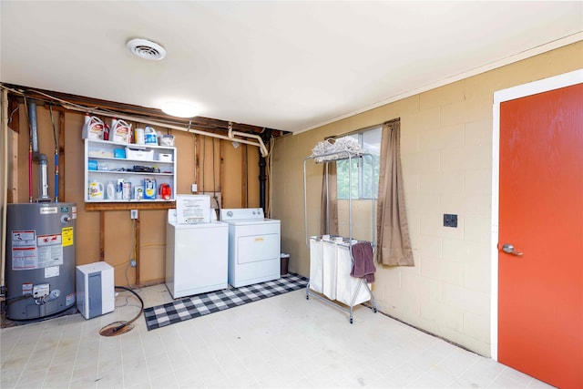 403 S Elm St, Lamoni, IA 50140 - basement with gas water heater, washer and dryer, and concrete block wall
