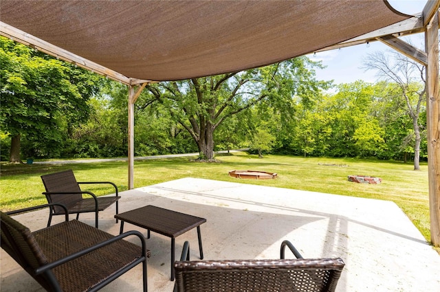 403 S Elm St, Lamoni, IA 50140 - view of patio / terrace with view of scattered trees and an outdoor fire pit