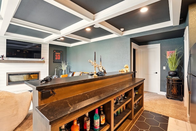 1108 NE Forest Ridge Ct, Ankeny, IA 50021 - bar area with dark colored carpet, beam ceiling, a large fireplace, coffered ceiling, and ornamental molding